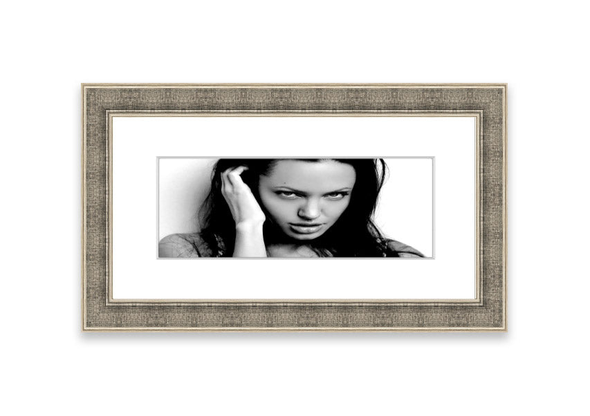 Framed print of Angelina Jolie with captivating eyes, available in various frame colors, handmade in the UK.