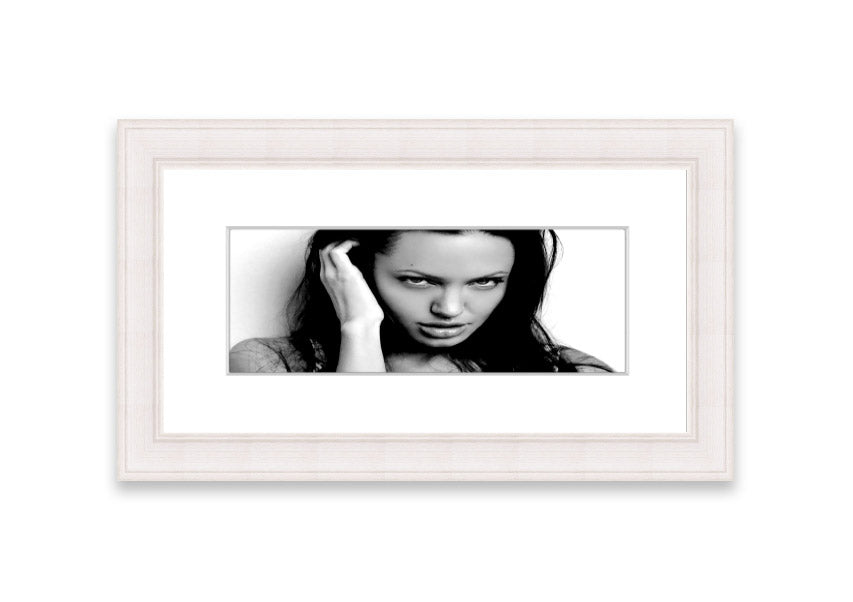 Framed print of Angelina Jolie with captivating eyes, available in various frame colors, handmade in the UK.