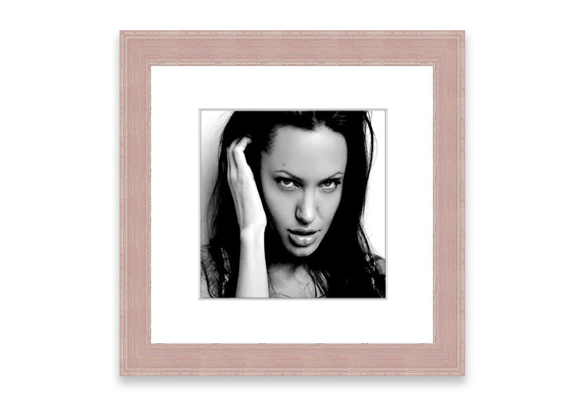 Framed print of Angelina Jolie with captivating eyes, available in various frame colors, handmade in the UK.