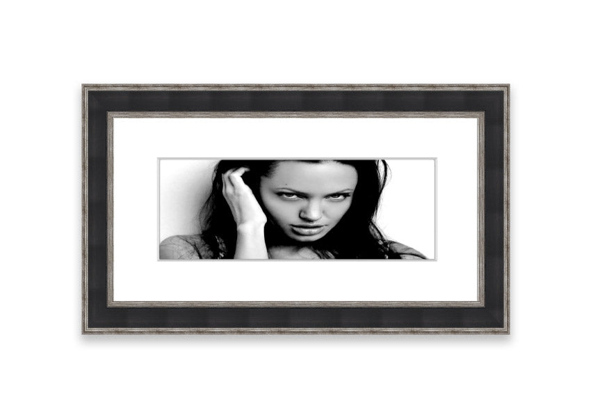 Framed print of Angelina Jolie with captivating eyes, available in various frame colors, handmade in the UK.