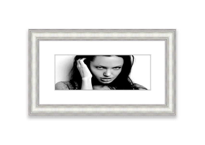 Framed print of Angelina Jolie with captivating eyes, available in various frame colors, handmade in the UK.