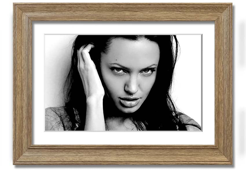 Framed print of Angelina Jolie's captivating eyes, showcasing her beauty and elegance.