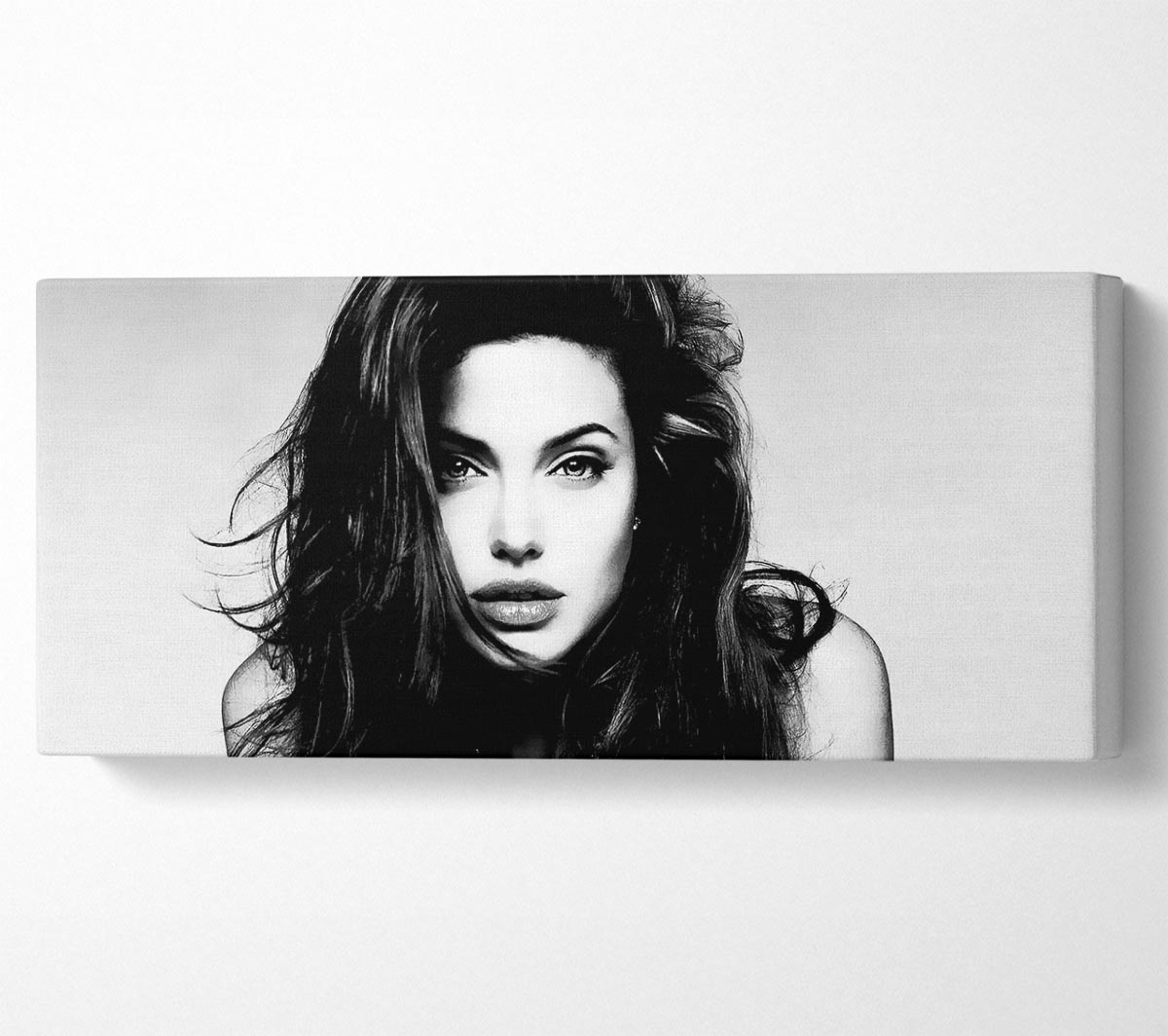 Canvas art featuring Angelina Jolie with a sexy stare, mounted on a 44mm box frame, ready to hang.