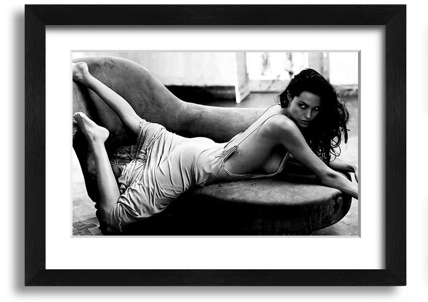 Angelina Jolie Sofa B n W framed print, showcasing a stylish black and white design, ready to hang.