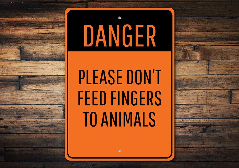 Animal Feeding Warning Sign made of durable aluminum, featuring clear warning text and pre-drilled holes for easy mounting.