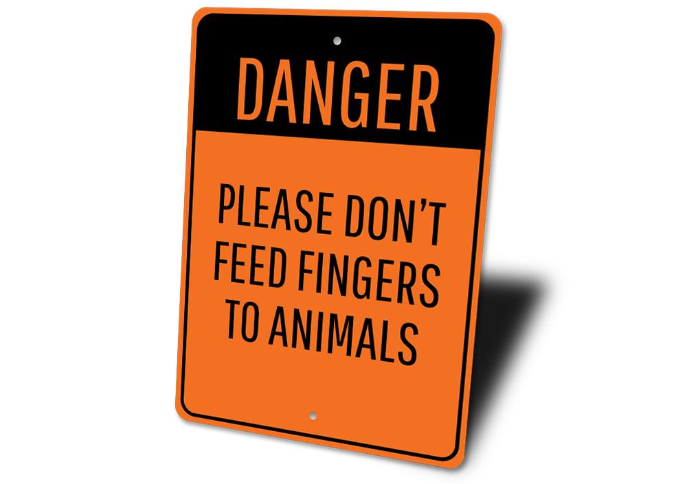 Animal Feeding Warning Sign made of durable aluminum, featuring clear warning text and pre-drilled holes for easy mounting.