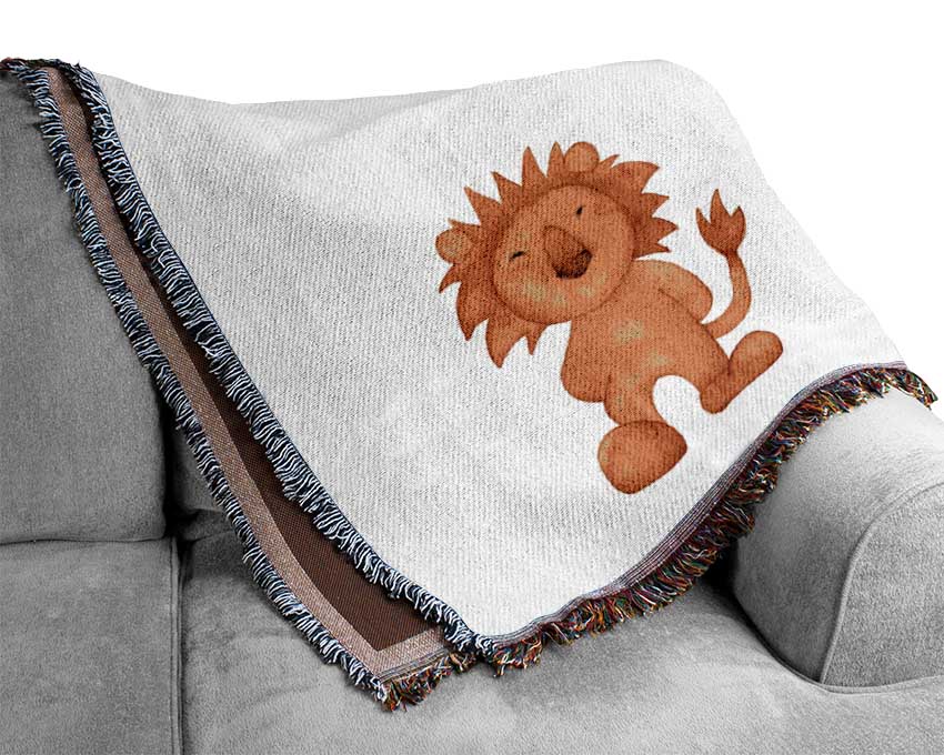 A luxurious Animal Fun throw blanket made from 100% cotton, featuring a thermal weave for breathability, draped elegantly over a couch.