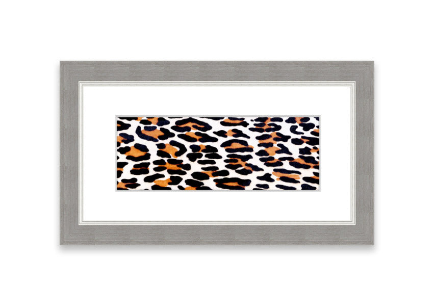 A beautifully framed print of animal skin design, showcasing intricate textures and colors, ready to hang on the wall.