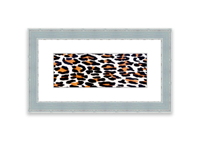 A beautifully framed print of animal skin design, showcasing intricate textures and colors, ready to hang on the wall.