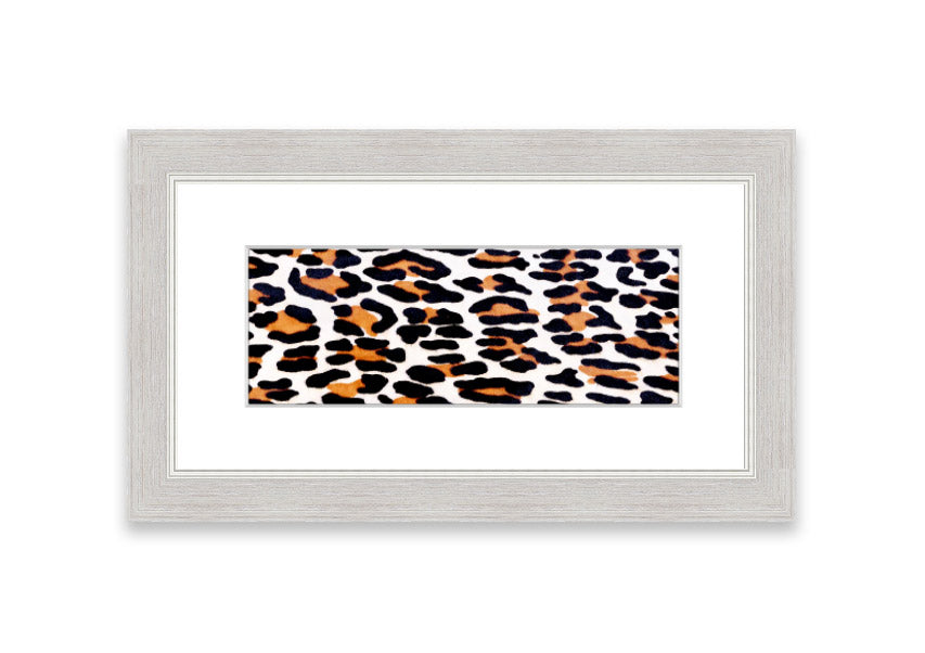 A beautifully framed print of animal skin design, showcasing intricate textures and colors, ready to hang on the wall.