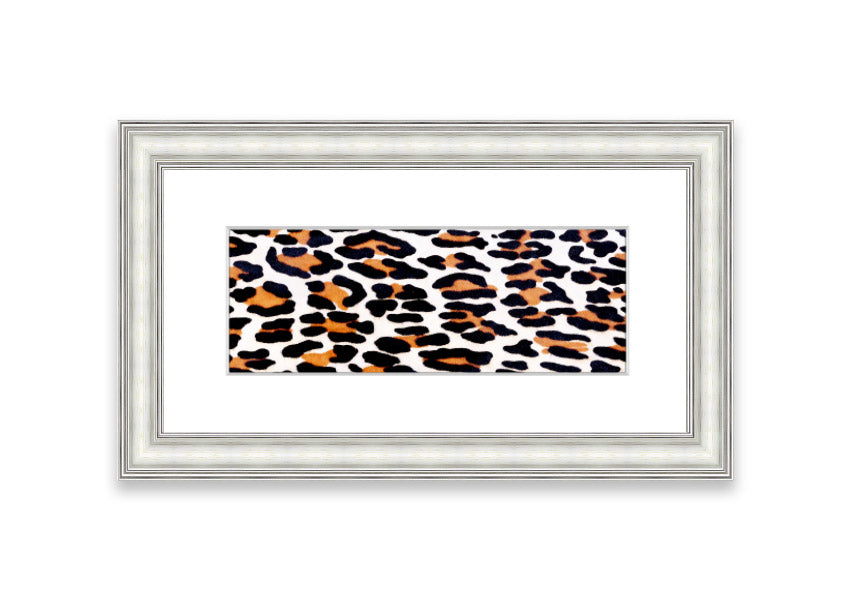 A beautifully framed print of animal skin design, showcasing intricate textures and colors, ready to hang on the wall.