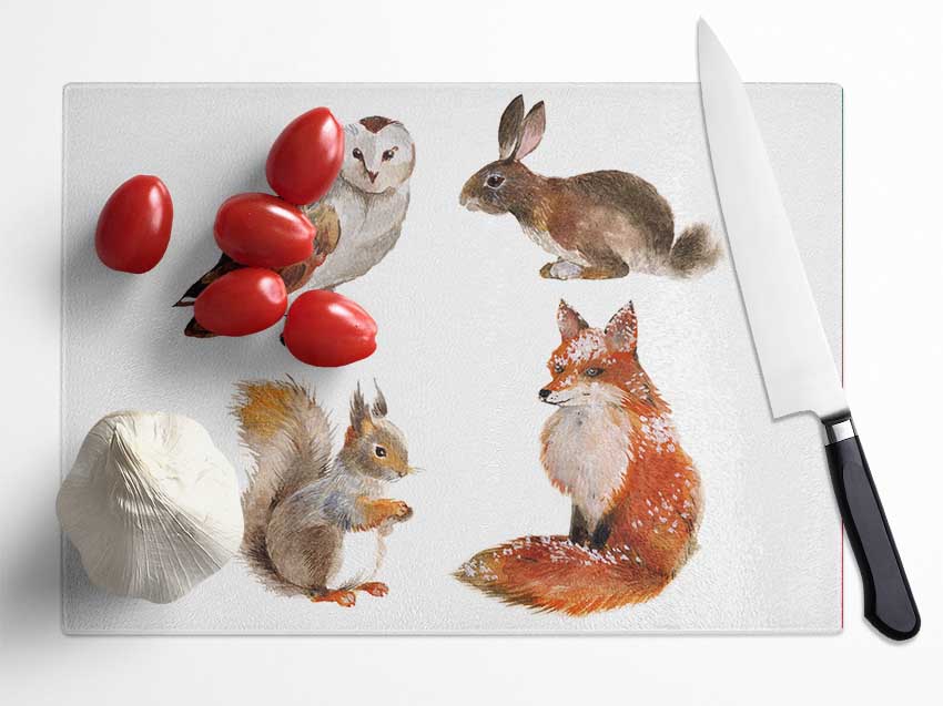 A beautifully designed chopping board featuring woodland animals, made from durable tempered glass with a chinchilla ripple effect.