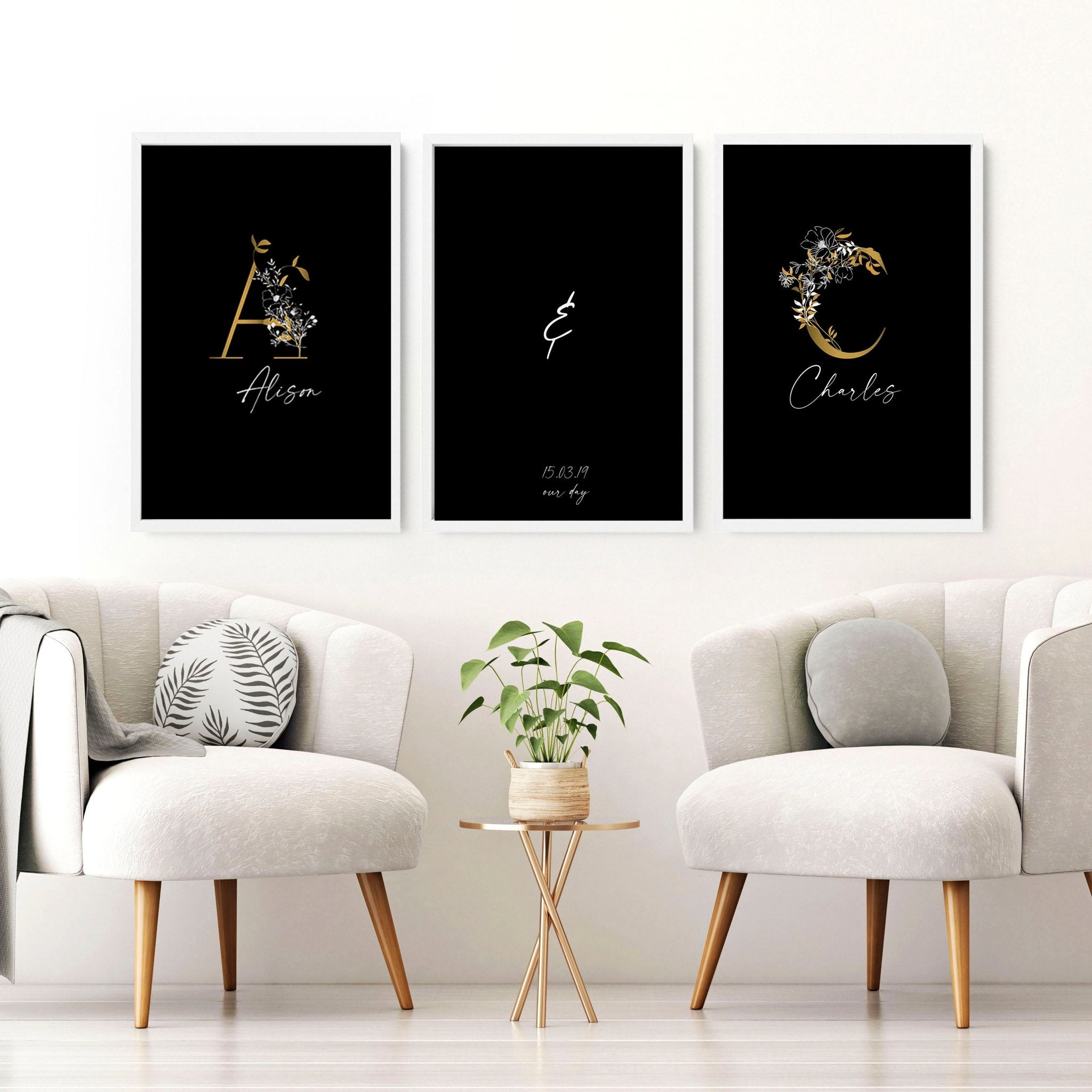 Set of 3 personalized wall art prints featuring botanical monogram designs in white, black, and gold on a black background.