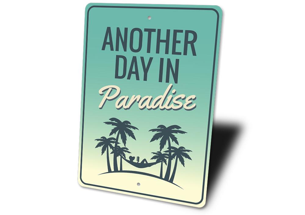 Another Day in Paradise decorative sign made of aluminum, featuring vibrant colors and beach-themed design, perfect for coastal decor.