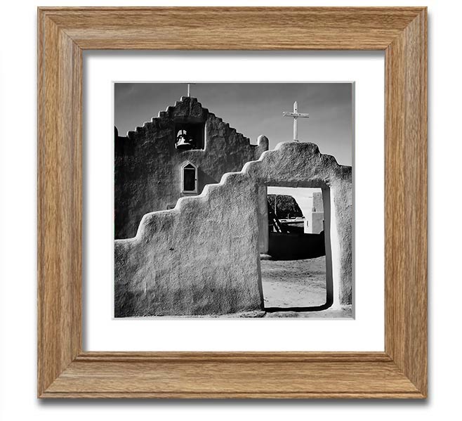 Square framed print of Ansel Adams' Church in Taos Pueblo, showcasing intricate details and available in various frame colors.