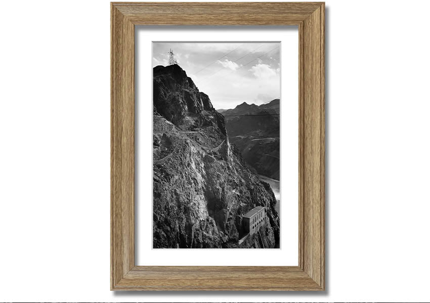 Framed print of Ansel Adams' Cliffs Above Boulder Dam, showcasing stunning black-and-white landscape photography.