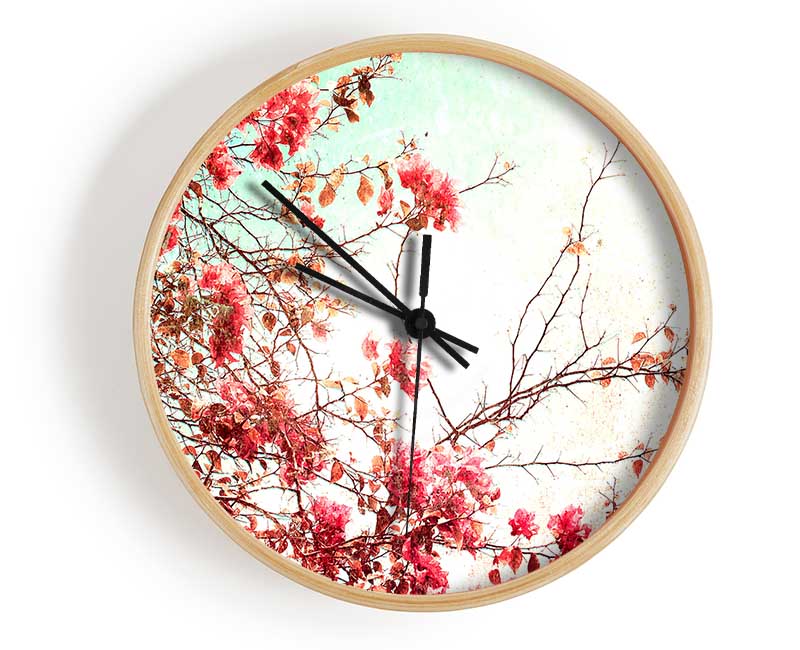 Antique Cherry Blossom clock made from natural bamboo with a round face and clear Plexiglas lens, available in black, white, and natural frame colors.