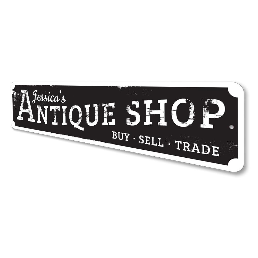 A beautifully crafted antique shop sign made of high-quality aluminum, featuring customizable text and pre-drilled holes for easy mounting.