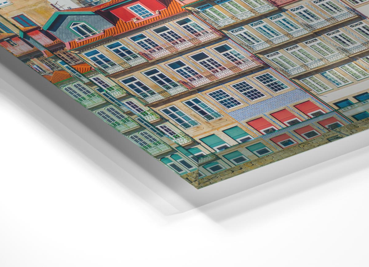 Modern glass print featuring coastal apartments, perfect for home decor.