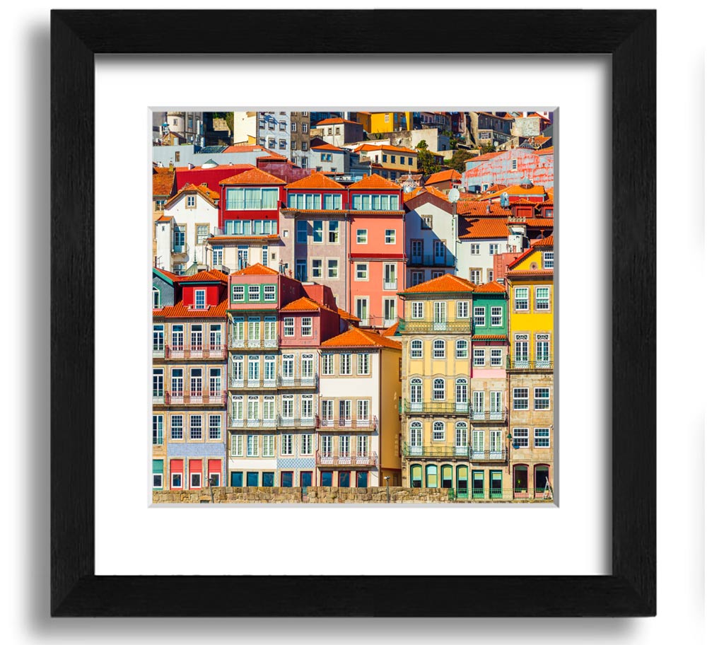 A beautifully framed print of coastal apartments, showcasing vibrant colors and intricate details, ready to hang on the wall.