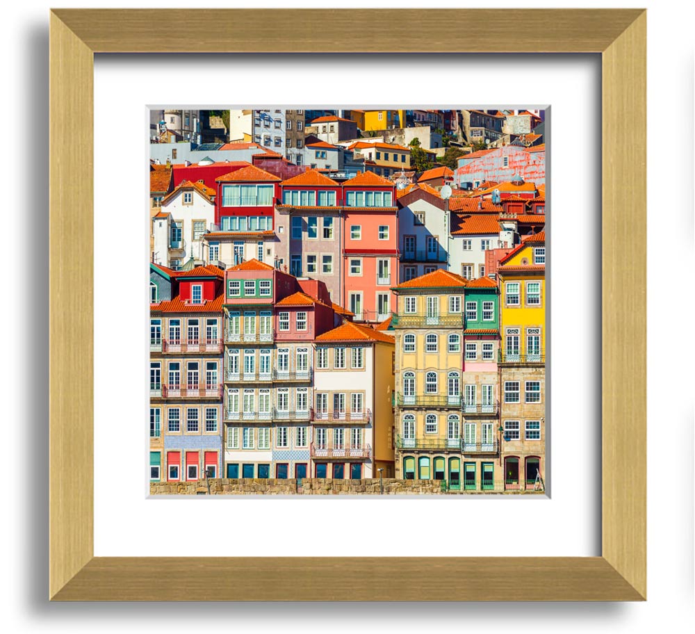 A beautifully framed print of coastal apartments, showcasing vibrant colors and intricate details, ready to hang on the wall.