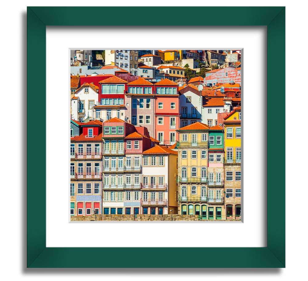 A beautifully framed print of coastal apartments, showcasing vibrant colors and intricate details, ready to hang on the wall.