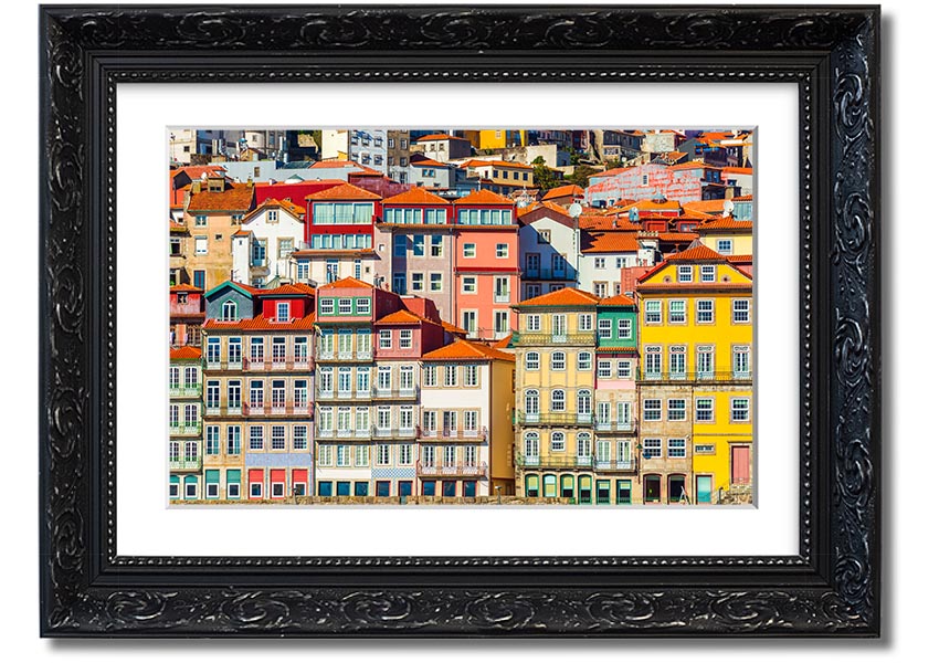 A beautifully framed print of coastal apartments, showcasing vibrant colors and intricate details, ready to hang on the wall.