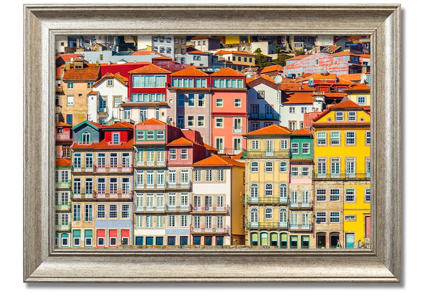 A beautifully framed print of coastal apartments, showcasing vibrant colors and intricate details, ready to hang on the wall.