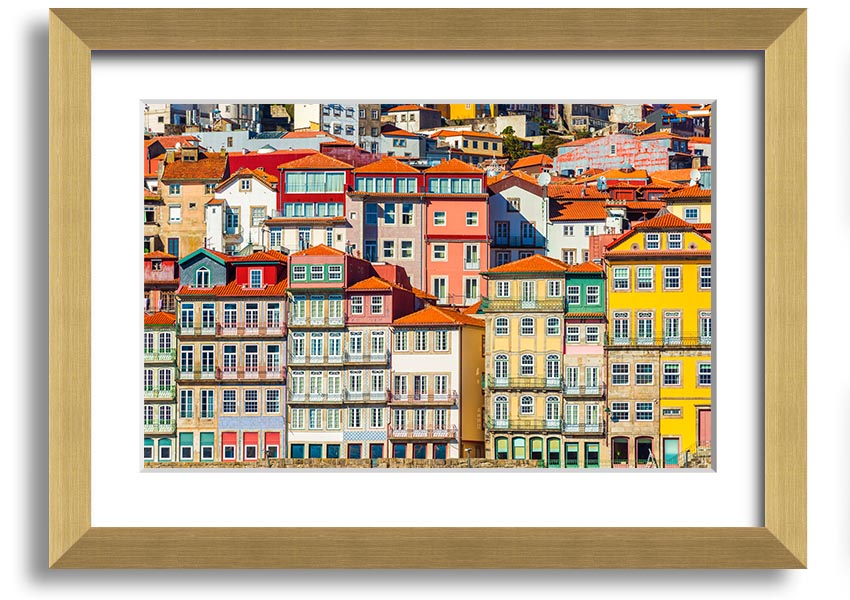 A beautifully framed print of coastal apartments, showcasing vibrant colors and intricate details, ready to hang on the wall.