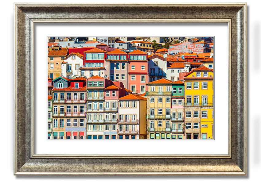 A beautifully framed print of coastal apartments, showcasing vibrant colors and intricate details, ready to hang on the wall.