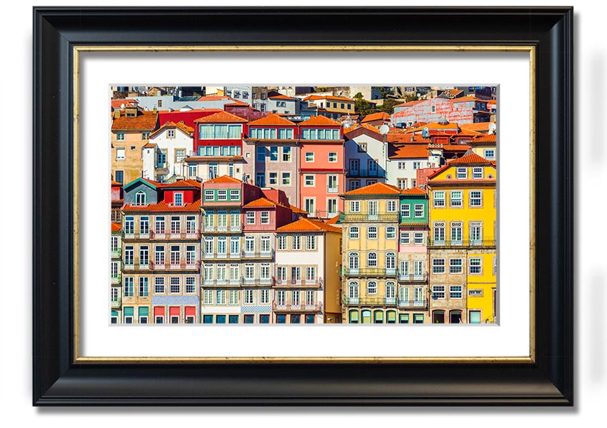 A beautifully framed print of coastal apartments, showcasing vibrant colors and intricate details, ready to hang on the wall.