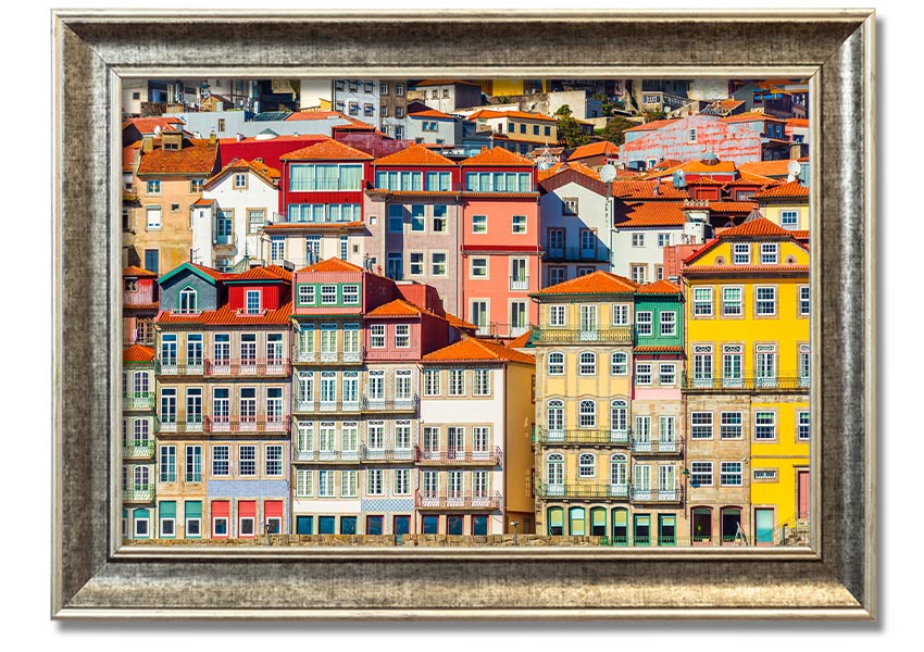 A beautifully framed print of coastal apartments, showcasing vibrant colors and intricate details, ready to hang on the wall.