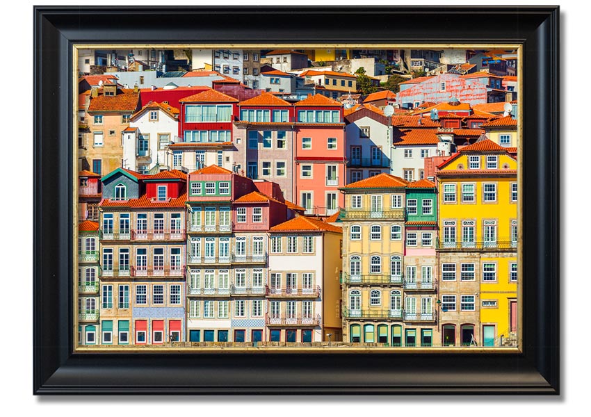 A beautifully framed print of coastal apartments, showcasing vibrant colors and intricate details, ready to hang on the wall.