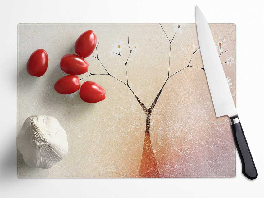 A beautifully designed Apple Blossom Tree chopping board made from tempered glass, featuring a chinchilla ripple effect and anti-slip feet.