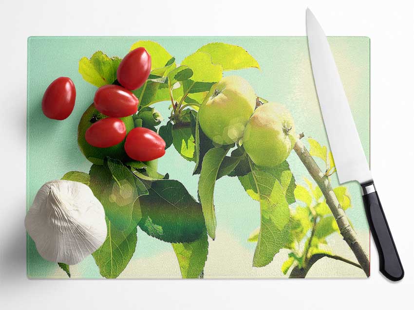 A stylish Apple Tree chopping board made from tempered glass with a chinchilla ripple effect and anti-slip feet.