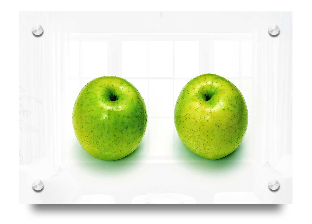 A vibrant acrylic print of two apples, showcasing rich colors and details, mounted on 5mm thick acrylic glass.