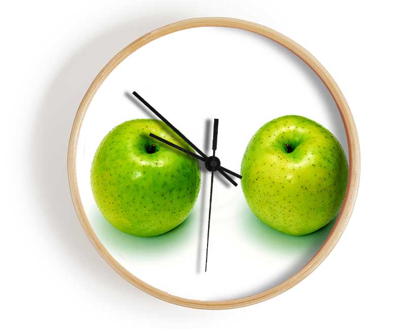 Apple Twins clock made from natural bamboo with a round face, available in black, white, and natural frame colors.