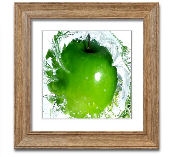 A vibrant square framed print of apples splashing in water, showcasing bright colors and dynamic imagery, ready to hang.