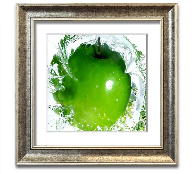 A vibrant square framed print of apples splashing in water, showcasing bright colors and dynamic imagery, ready to hang.