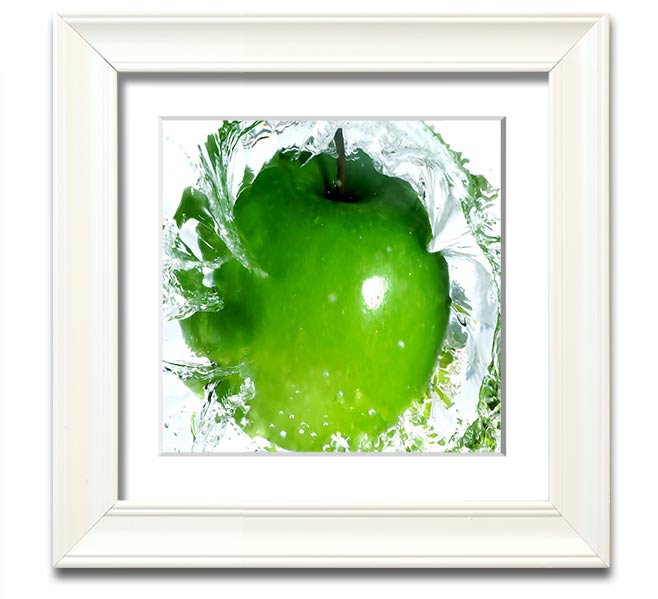 A vibrant square framed print of apples splashing in water, showcasing bright colors and dynamic imagery, ready to hang.