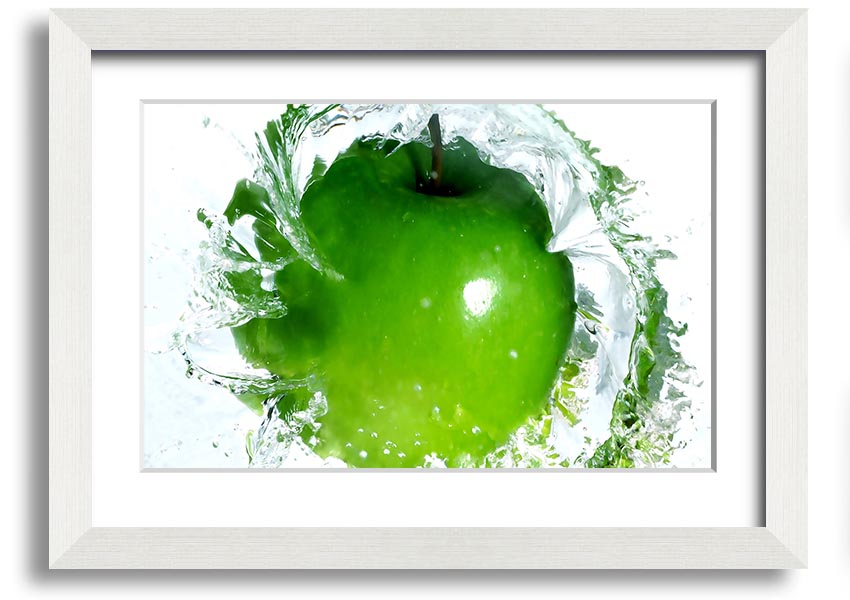 A vibrant framed print of an apple water splash, showcasing dynamic colors and textures, ready to hang on a wall.