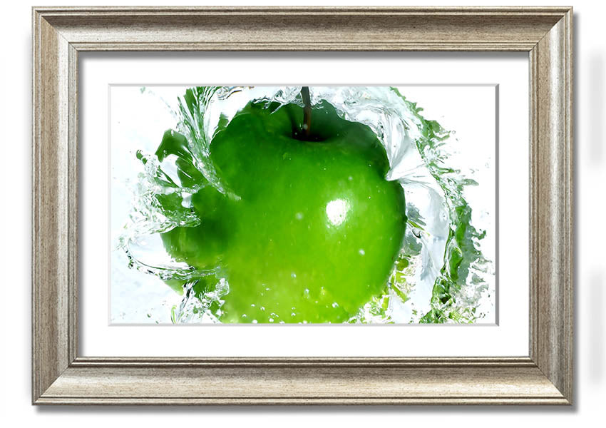 A vibrant framed print of an apple water splash, showcasing dynamic colors and textures, ready to hang on a wall.