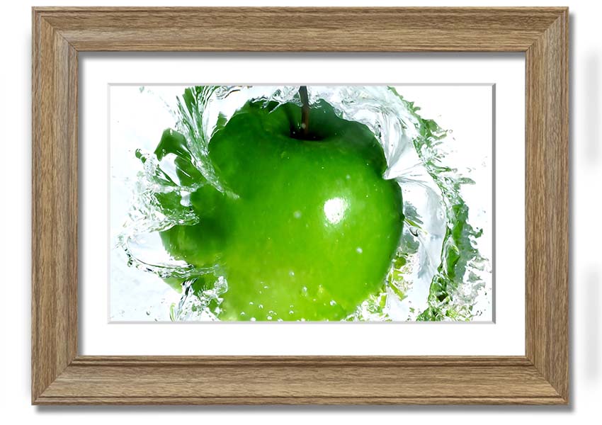 A vibrant framed print of an apple water splash, showcasing dynamic colors and textures, ready to hang on a wall.