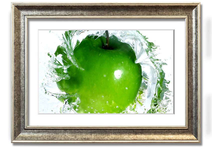 A vibrant framed print of an apple water splash, showcasing dynamic colors and textures, ready to hang on a wall.