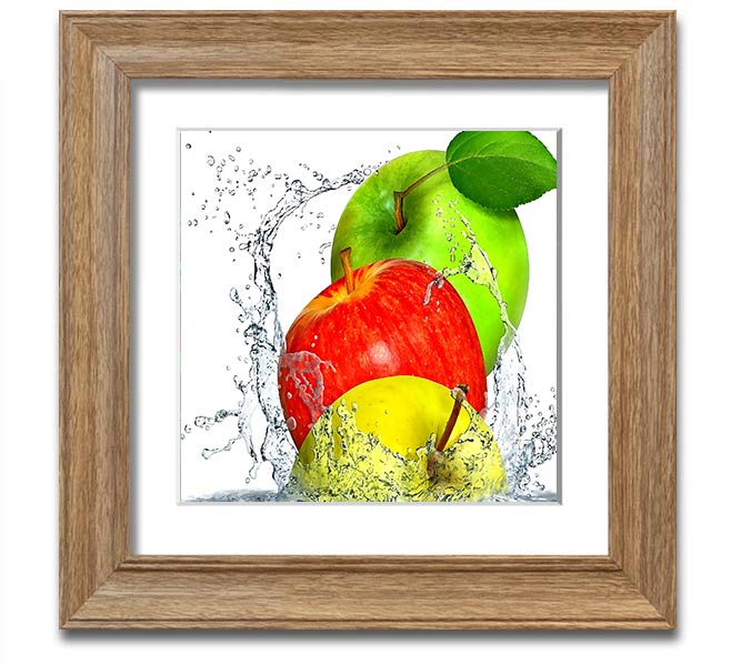 A vibrant square framed print featuring apples splashing in water, showcasing dynamic colors and a refreshing design.