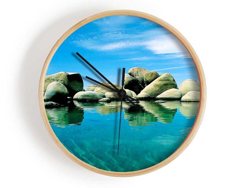 Aqua Rock Pool clock made of natural bamboo with a round face, available in black, white, and natural frame colors.