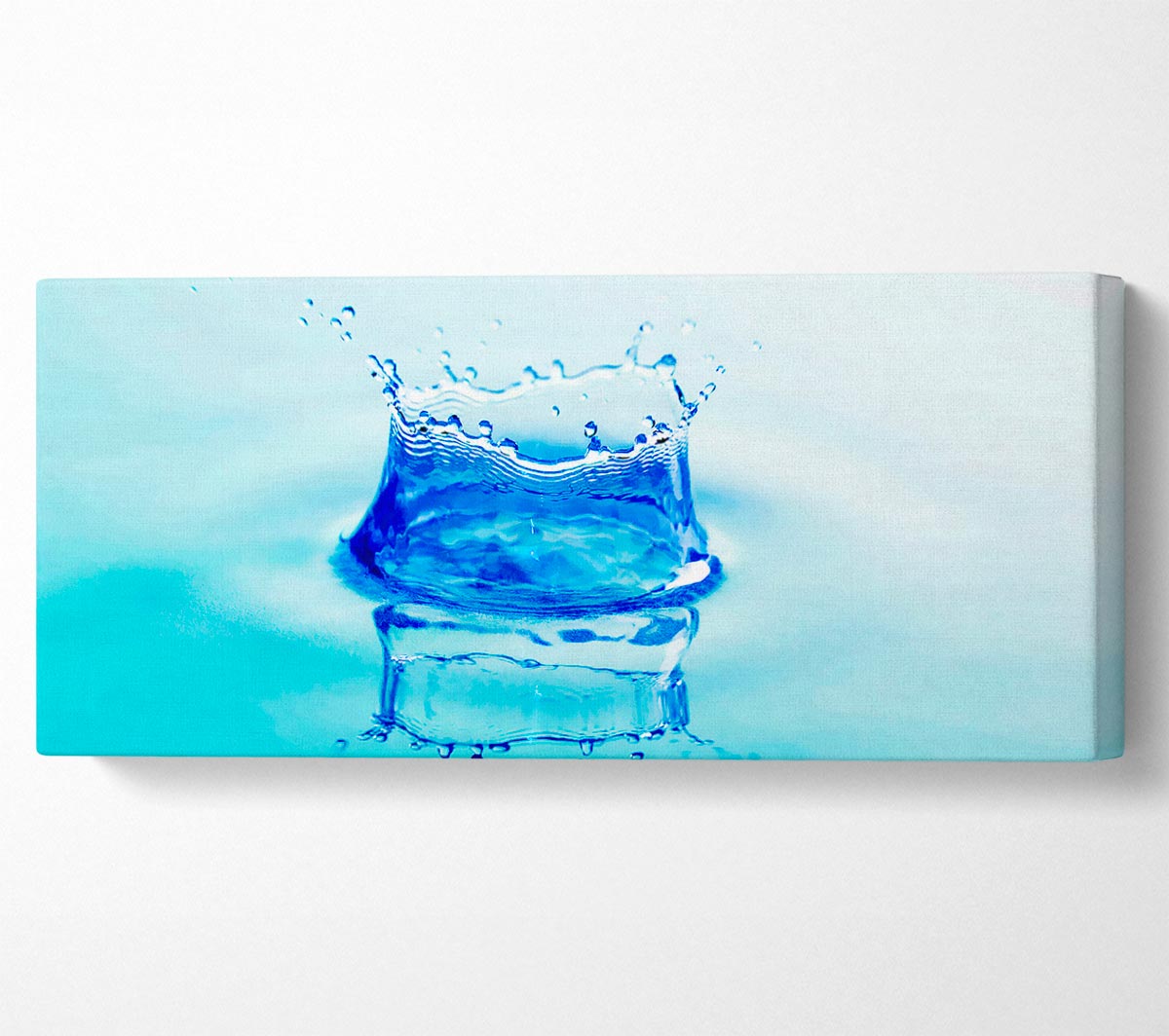 Aqua Splash canvas art featuring vibrant colors, mounted on a sturdy 44mm box frame, ready to hang.