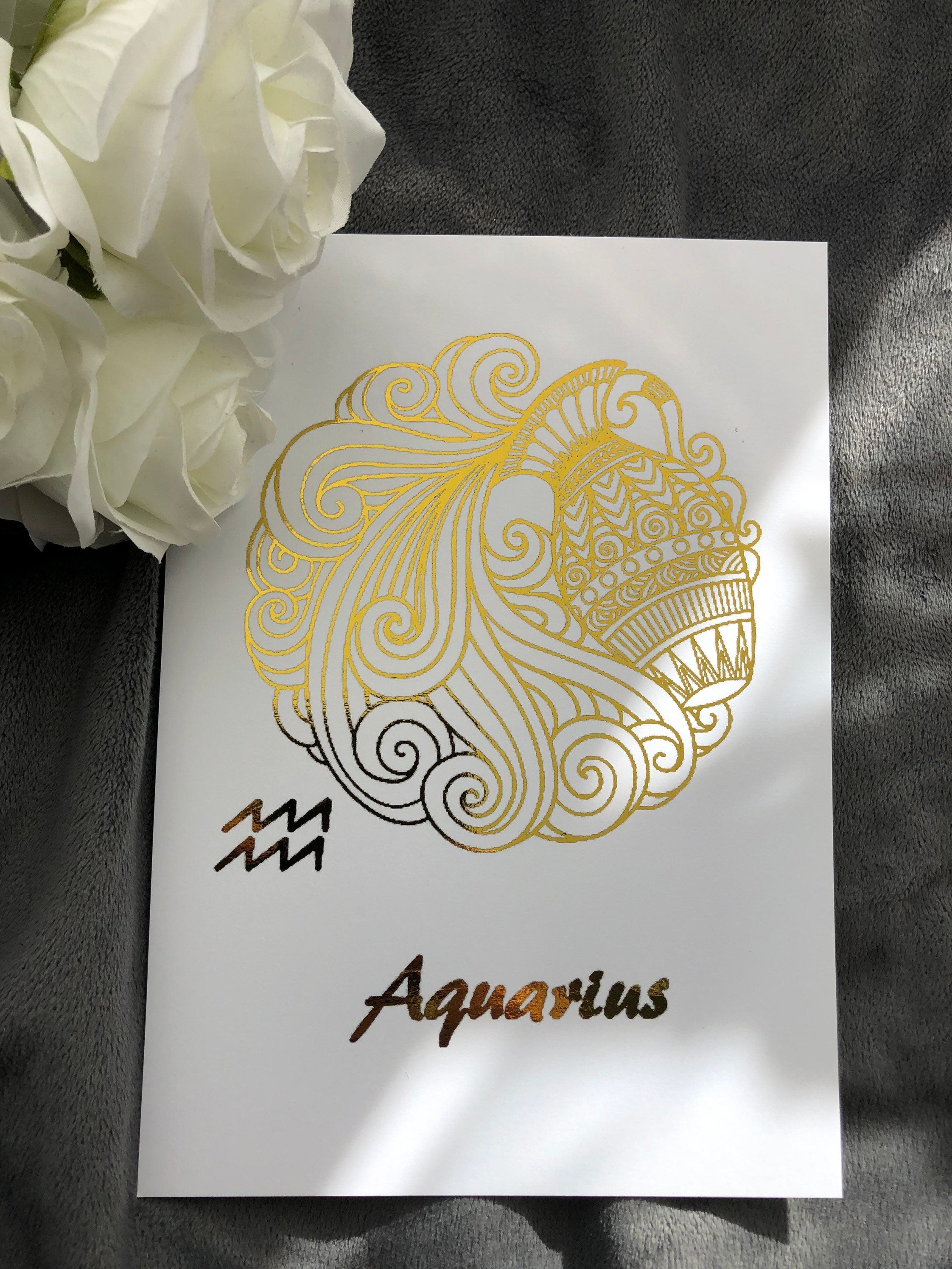 Aquarius Star Sign Foil Print featuring intricate designs and elegant foil detailing, representing the water bearer symbol.