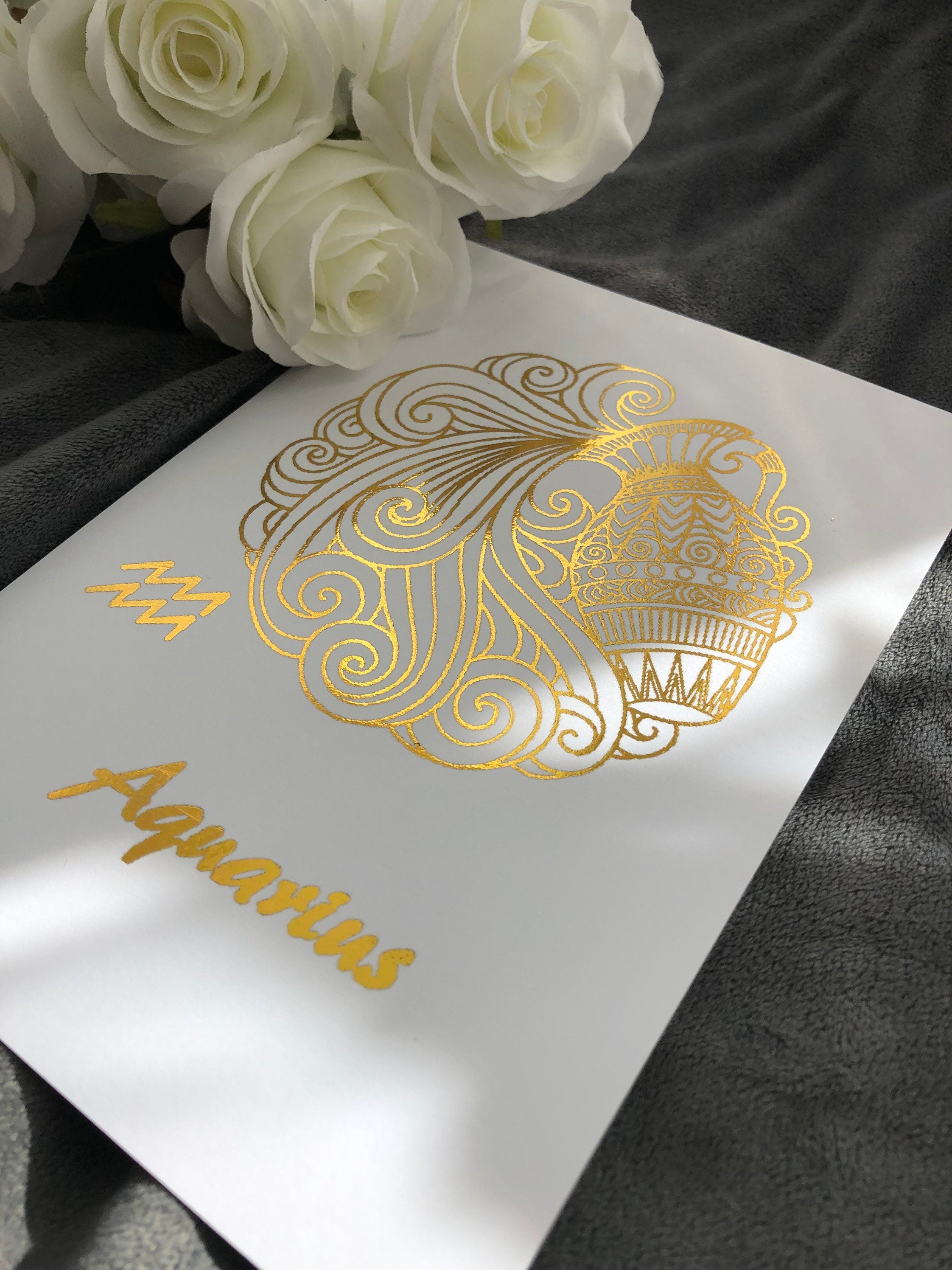 Aquarius Star Sign Foil Print featuring intricate designs and elegant foil detailing, representing the water bearer symbol.