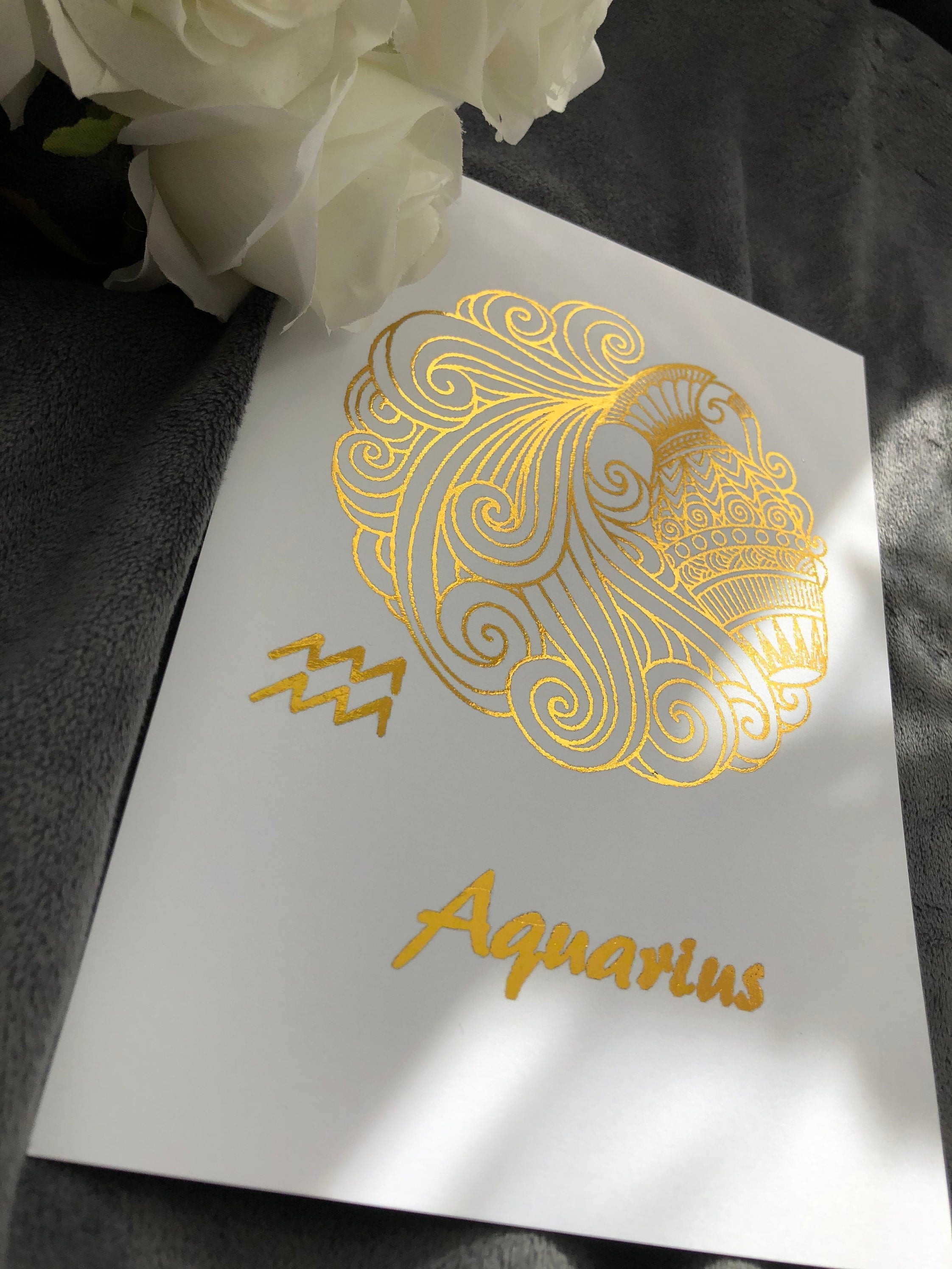 Aquarius Star Sign Foil Print featuring intricate designs and elegant foil detailing, representing the water bearer symbol.